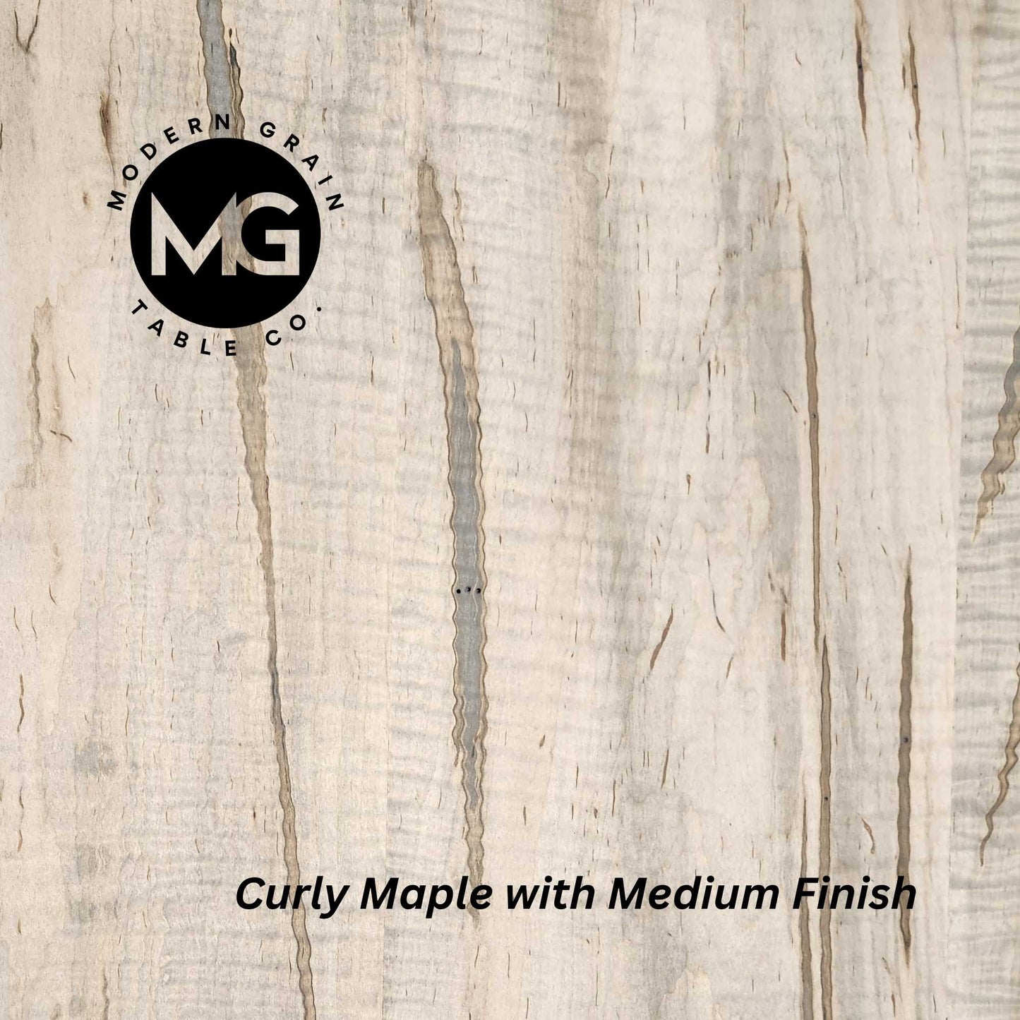 Zoomed-in view of Ambrosia Maple hardwood featuring subtle streaks and smooth natural texture