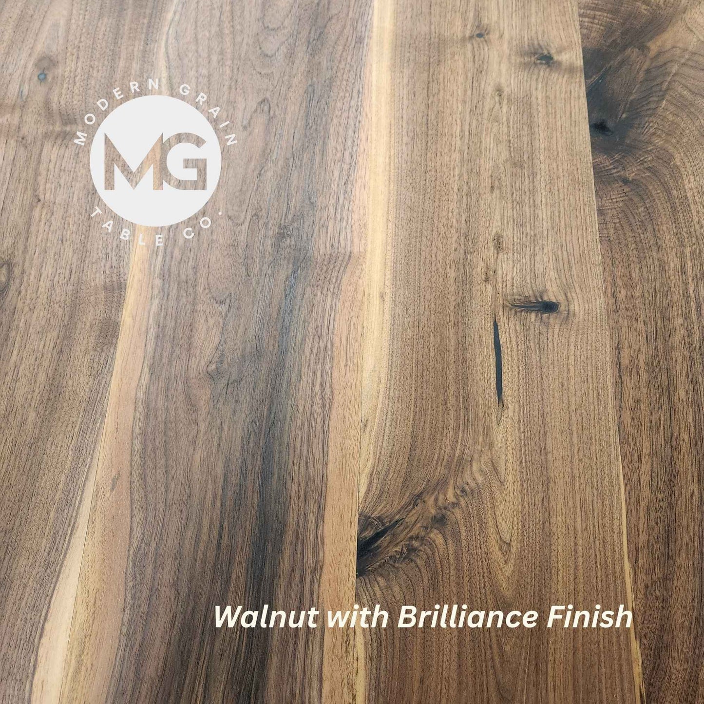 Close-up of Walnut hardwood with Brilliance finish from Modern Grain Table Co., showcasing rich brown tones, natural grain depth, and a smooth matte sheen.