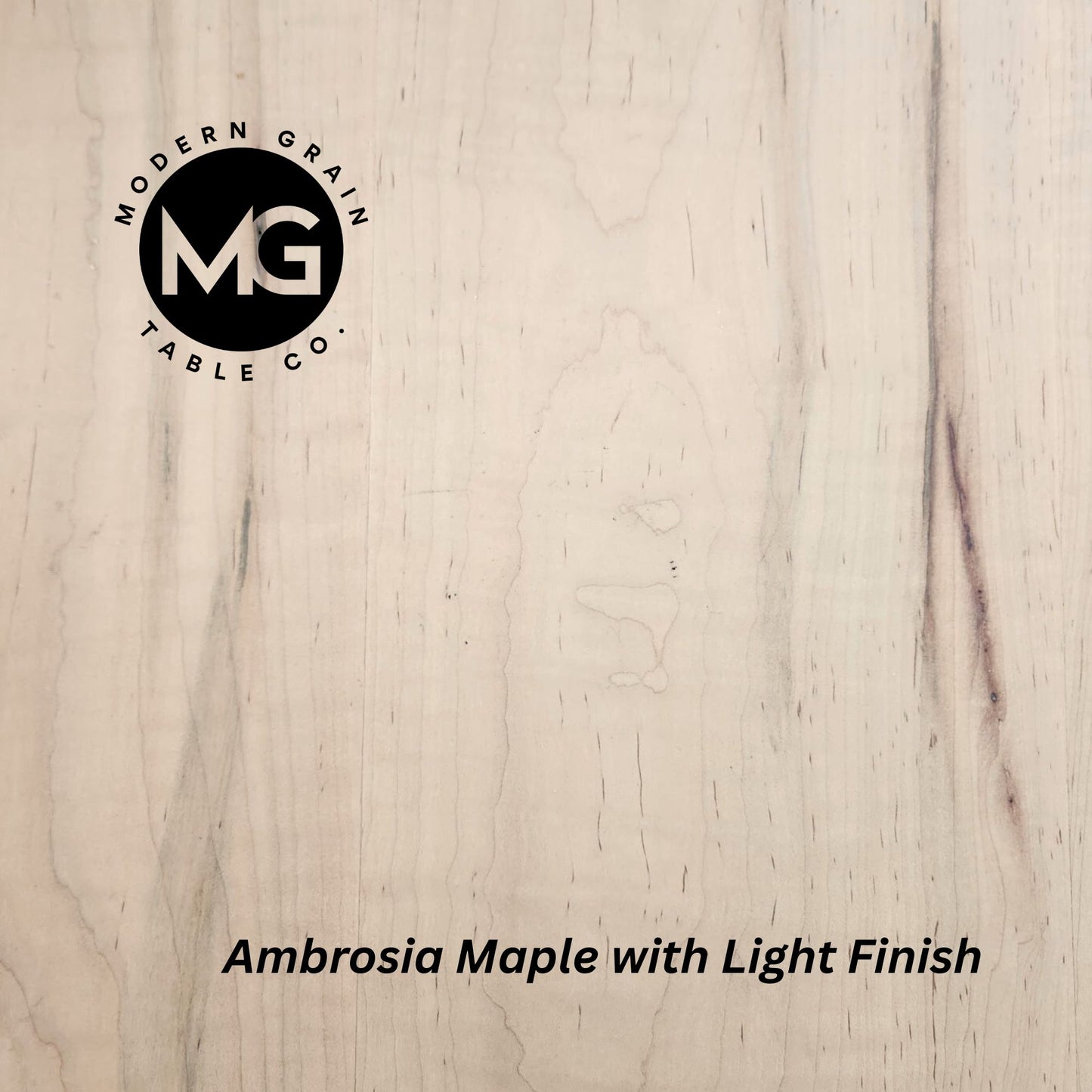 Detailed image of Ambrosia Maple wood showing creamy base tones with unique gray and brown streaks