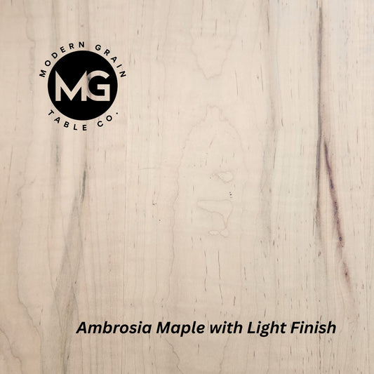 Detailed image of Ambrosia Maple wood showing creamy base tones with unique gray and brown streaks