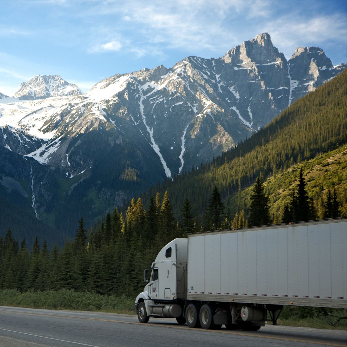 Freight truck delivering a fully assembled hardwood table from Modern Grain Table Co.