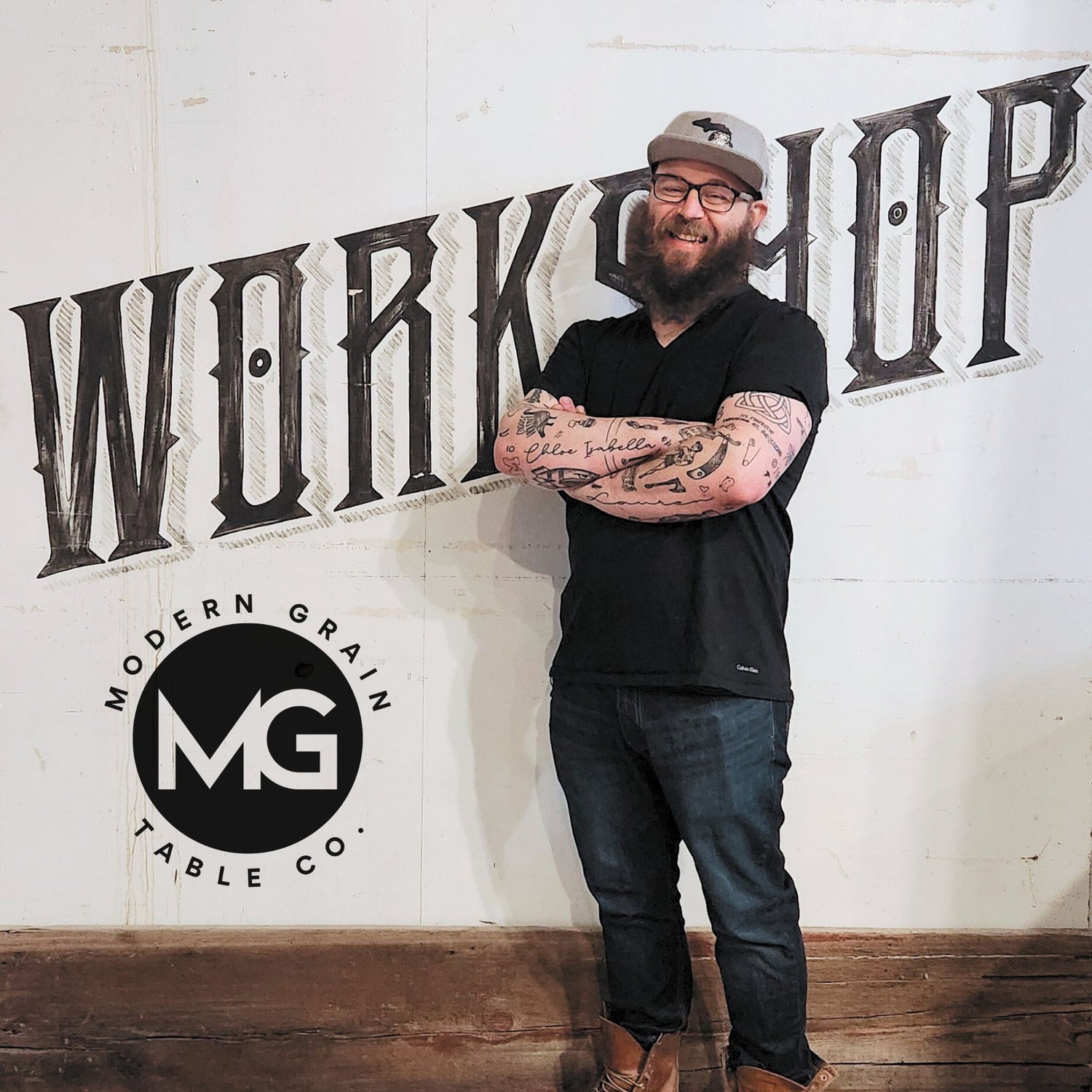 Justin Hammond, founder and craftsman at Modern Grain Table Co., standing in the workshop